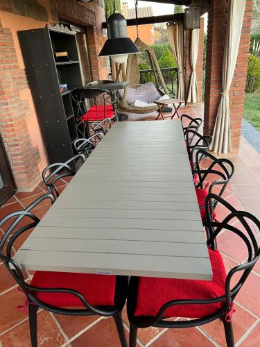 a white table and chairs on a patio at Villa Sol Luxury Costa Brava Golf in Peralada