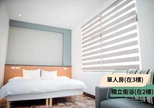 Una cama o camas en una habitación de 西湖柚子家民宿