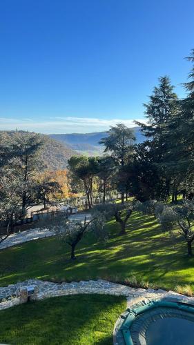 a view of a yard with a swimming pool and trees at Villa Jasmine in Arcugnano