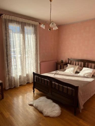 מיטה או מיטות בחדר ב-Villa Le Rocher