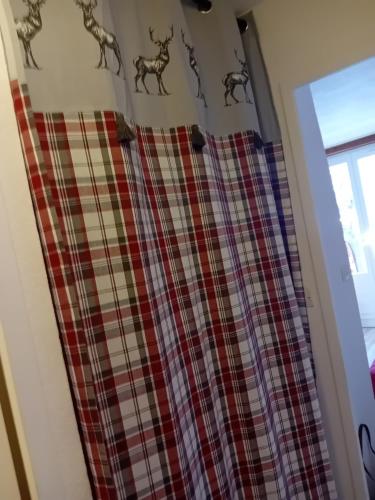 a curtain with deer on it in front of a window at chamois tétras marmotte in Allos