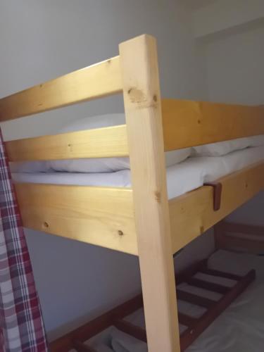 a couple of bunk beds in a room at chamois tétras marmotte in Allos