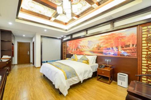 Postel nebo postele na pokoji v ubytování Zhangjiajie Guanshanyuan B&B