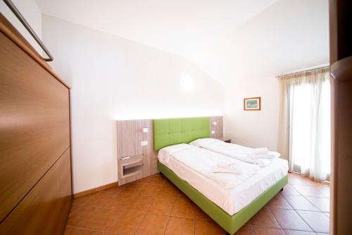 Postel nebo postele na pokoji v ubytování Hotel Menapace