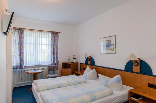 Postel nebo postele na pokoji v ubytování Hotel Kiek ut