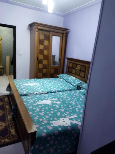 a bedroom with two beds with hello kitty sheets at Hurghada City Apartment1 in Hurghada