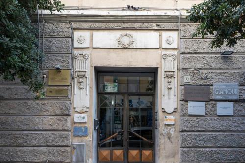 a stone building with a door with a window at Enchanting Suites Salerno in Salerno