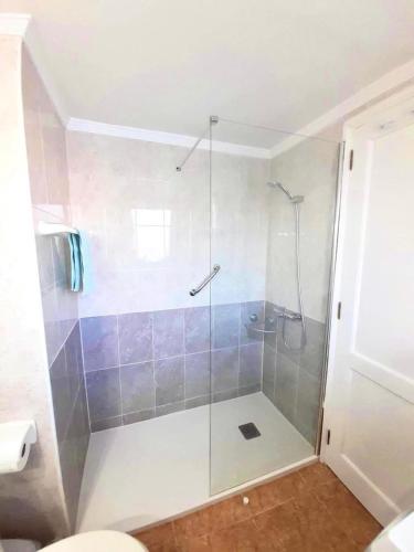 a shower with a glass door in a bathroom at Apartamento Lory-Puerto del Carmen in Tías