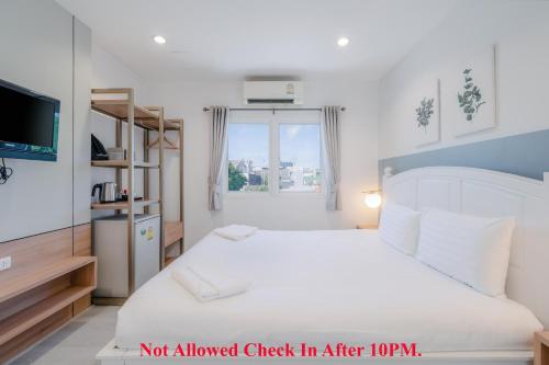Katil atau katil-katil dalam bilik di Baan Sutra Guesthouse