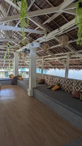 a large room with couches in the middle of it at Happiness Hostel Boracay in Boracay