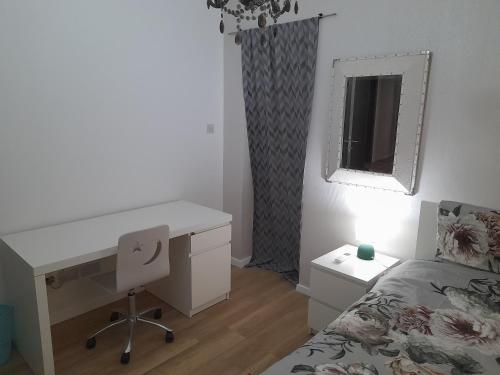 a bedroom with a desk and a bed and a desk and a desk at Cosy 4 Bedroom Apt with use of Pool in St Paul's Bay
