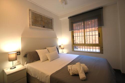 Tempat tidur dalam kamar di Apartamento CasaTuris en Santa Pola la Cala V SP103