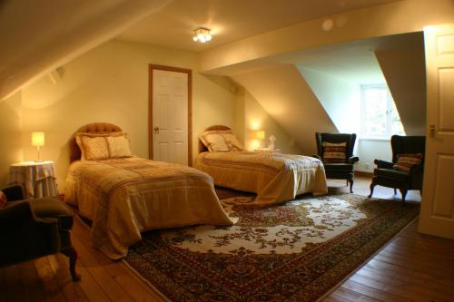 a bedroom with two beds in a attic at Glenlyon Bed and Breakfast - NEC in Hampton in Arden