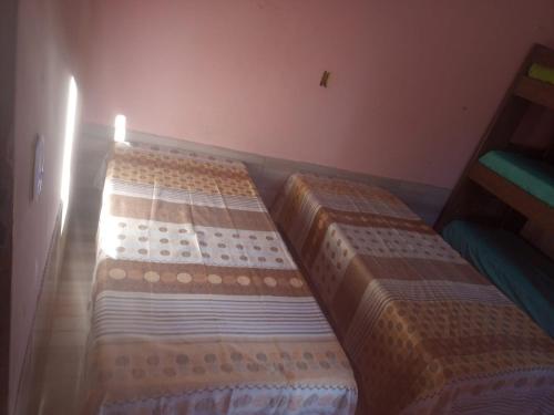 Ένα ή περισσότερα κρεβάτια σε δωμάτιο στο Casa da Edileusa