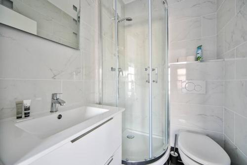 a bathroom with a shower and a toilet and a sink at 02.Studio#Charenton#Fitness#Cinema in Charenton-le-Pont