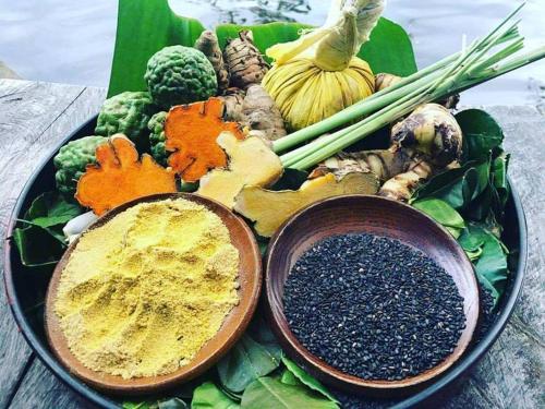 a plate of different types of vegetables on a table at Banteay Srey Women's Only Traditional Spa and Homestay in Kampot