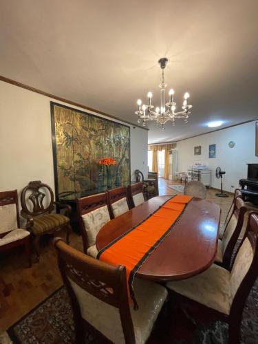 a dining room with a table and chairs at Spacious Luxury 3BR at the Heart of Makati in Manila