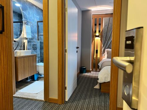 a room with a bathroom with a sink and a mirror at istanbul vipinnhotels in Istanbul