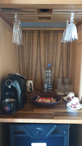 a kitchen counter with a toaster and a plate of food at Bay Lodge Boutique Hotel in Jounieh