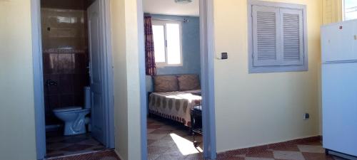 Katil atau katil-katil dalam bilik di Villa de l'ermitage