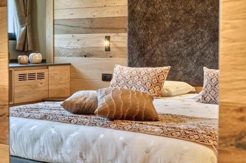 Ein Bett oder Betten in einem Zimmer der Unterkunft Brunet - The Dolomites Resort