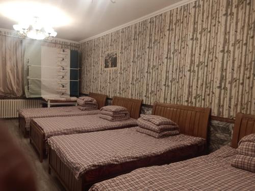 Cama o camas de una habitación en Yabuli Farm House Hotel