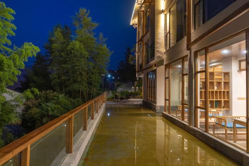 an external view of a building at night at Zhangjiajie Qiquan Vacation B&B in Zhangjiajie