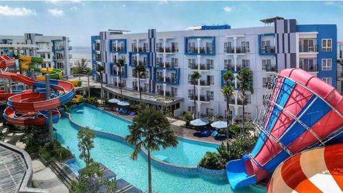 a resort with a water slide and a roller coaster at Pentapolis Apartment in Balikpapan