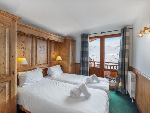 Ένα ή περισσότερα κρεβάτια σε δωμάτιο στο Appartement Val Thorens, 3 pièces, 6 personnes - FR-1-640-13