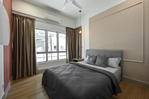 a bedroom with a bed and a large window at Razak City Residence in Kuala Lumpur