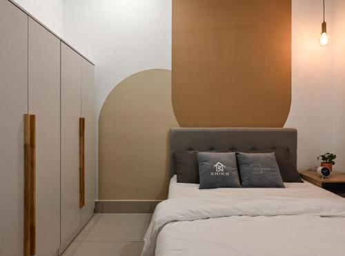 a bedroom with a bed with a brown headboard at Razak City Residence in Kuala Lumpur