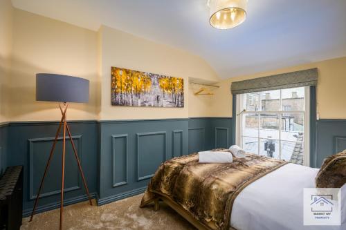 a bedroom with a bed and a window at Isabella's Beach House Scarborough - 4 Bedroom in Scarborough