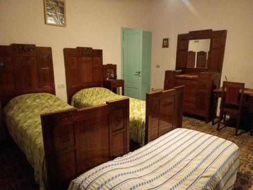 Ένα ή περισσότερα κρεβάτια σε δωμάτιο στο Villa Elda - b&b in historic house