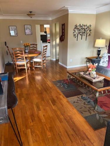 a living room with a couch and a table at Perfect place quiet neighborhood, great for the family. in Saginaw