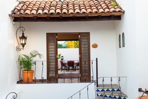 an open door of a house with a patio at BellView Hotel Boutique in Puerto Vallarta