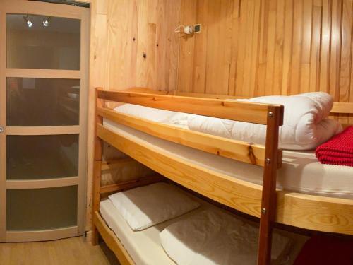 a couple of bunk beds in a room at Studio Les Saisies, 1 pièce, 4 personnes - FR-1-293-167 in Les Saisies