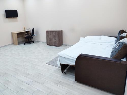 Ένα ή περισσότερα κρεβάτια σε δωμάτιο στο Апартаменты Daily Home