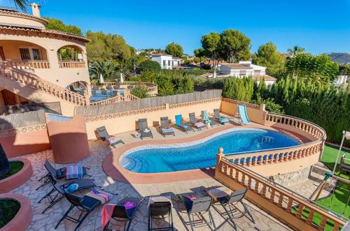 an image of a swimming pool in a house at Villa Navacerrada - PlusHolidays in Teulada