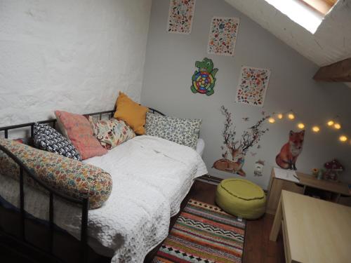 a bedroom with a bed and a chair in it at Bienvenue à La Sélinière ! in Champ-du-Boult