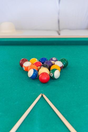a group of billiard balls on a pool table at Villa Navacerrada - PlusHolidays in Teulada