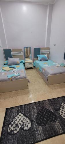En eller flere senge i et værelse på Ahmed House 1
