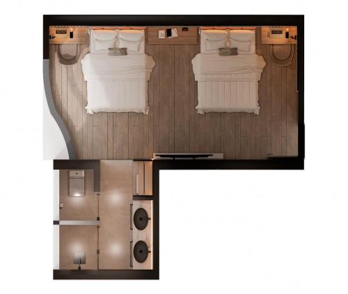 a floor plan of a bedroom with two beds at hotel taymi in Trujillo