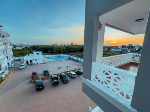 a view from a balcony of a parking lot at Kezmo Siloam Paradise in Mombasa