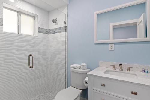 a bathroom with a shower and a toilet and a sink at Captain Ed's - Charming Studio at PalmView of Sanibel with Bikes in Sanibel