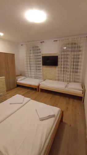 Postel nebo postele na pokoji v ubytování Euro Apartman