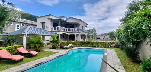a house with a swimming pool in front of it at Serenity Villa in Balaclava