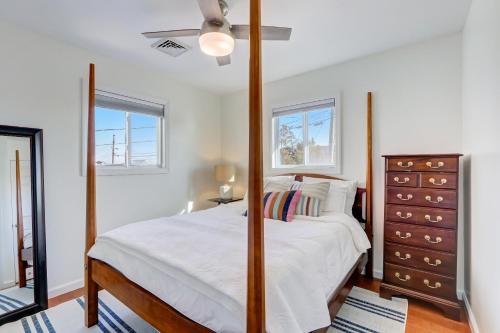 a bedroom with a bed with a dresser and a mirror at Mystic Island Bay Breeze in Little Egg Harbor Township