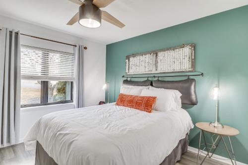 a bedroom with a large bed with a ceiling fan at Harrisonburg Home with Deck - 2 Mi to JMU! in Harrisonburg