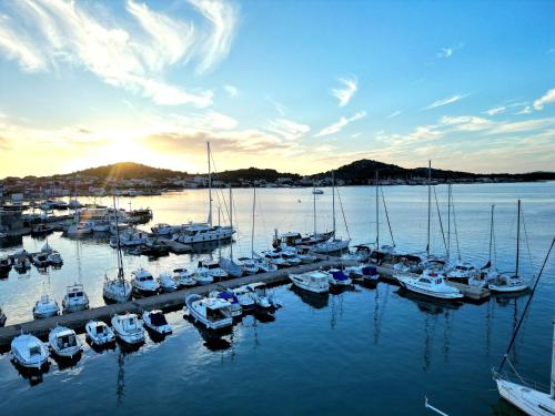 a group of boats docked at a dock in the water at SEAVIEW in Sveti Filip i Jakov
