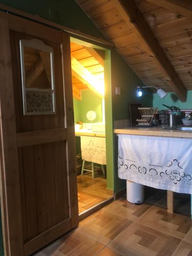 a kitchen with a counter and a counter top at Guesthouse Kontogianni - Materka in Nymfaio